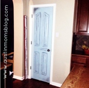 Turquoise door with growth chart where we measure our babes.