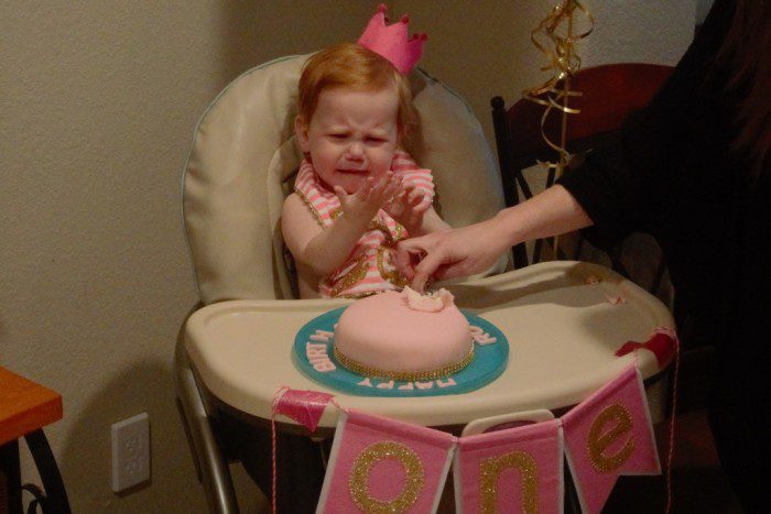 She got cake on her hands. 