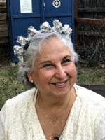 The author's mom wears a literal silver crown of tin foil and a metaphorical silver crown of natural hair.