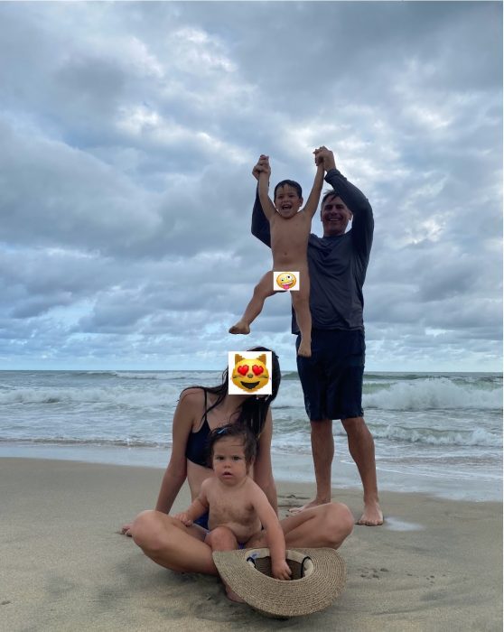 The author's husband and kids pose at the beach. The two youngest are naked to illustrate a family culture comfortable with nudity and discussing human sexuality.