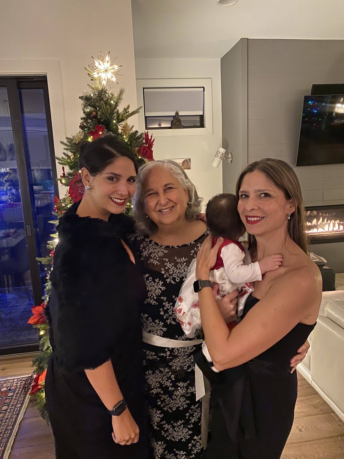 The author poses with her mother and her sister, who is holding her baby daughter