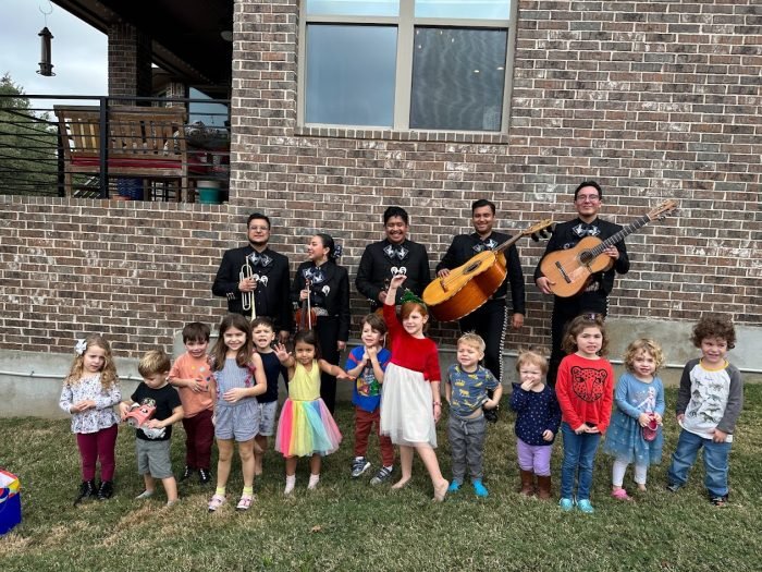 A group of mariachis pose with the guests at the author's son's 4th birthday party.